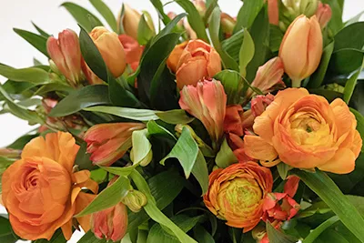 mixed bouquet of orange flowers at home